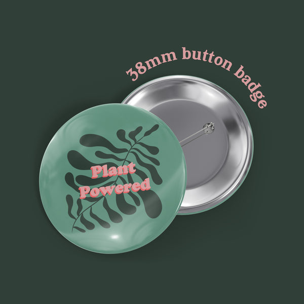 image of a badge featuring the words plant powered with a leaf motif in shades of green behind.