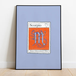 Image of a framed art print leaning against the wall. The art print itself is a postage stamp representing the star sign of scorpio. The print is bright and colourful in shades of blue and vibrant red.
