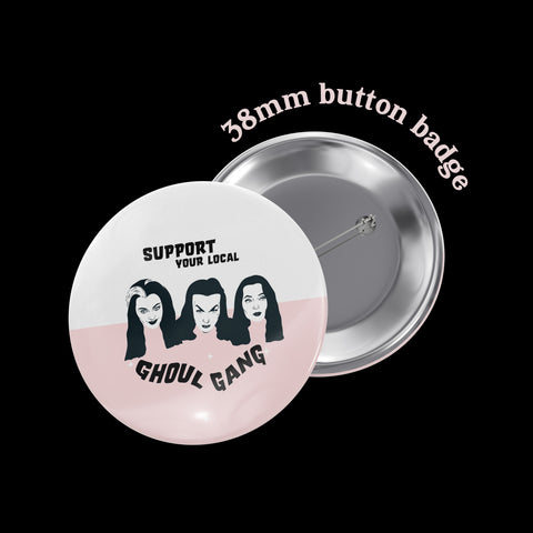 image of a whatmabeldid button badge featuring illustrations of morticia addams, vampira and lily munster with the phrase support your local ghoul gang.