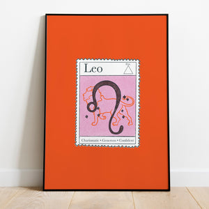 Image of a framed art print leaning against the wall. The art print itself is a postage stamp representing the star sign of Leo. The print is bright and colourful in shades of lavender, maroon and red.