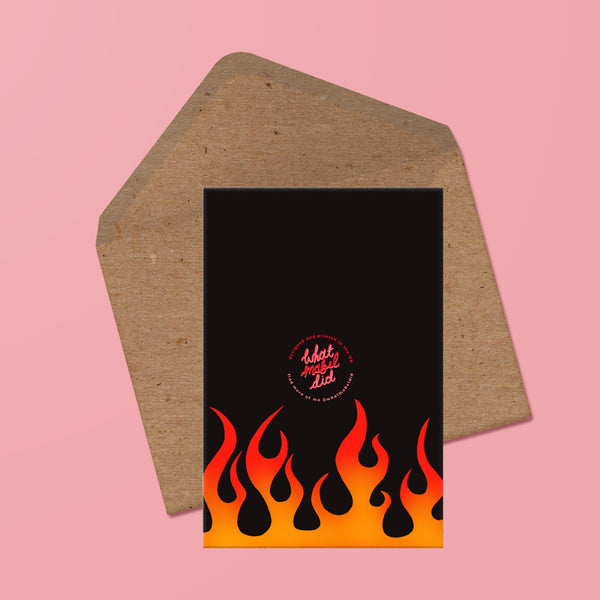 image of the back of a card featuring an illustration of  stylised flames and the whatmabeldid logo. the words love you to death in handwritten, ra. the card is presented with a recycled kraft envelope behind