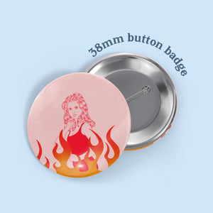 image of a button badge featuring an illustration of buffy the vampire slayer in red linework with a pale pink background and stylised flames