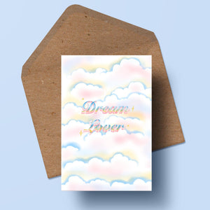 image of an airbrushed card featuring clouds and the text dream lover