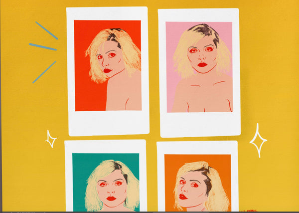 a zoomed in look at an Illustration print of 4 photos of debbie harry of blondie fame. The background to each polaroid is a different colour of red, pink, orange and teal. there is a lipstick kiss mark in the bottom right hand corner.