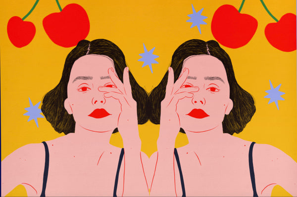 a zoomed in look at an illustration print of two identical women with retro styling. above them are stylised red hands holding cherries, the background is a bright yellow and features pake blue stars.