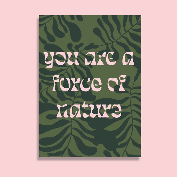 postcard featuring the words you are a force of nature in pale pink. the background is an overlapping leaf design in shades of green.