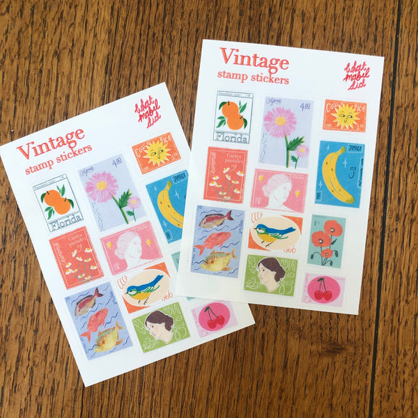 two sticker sheets featuring a selection of vintage inspired postal stamps.