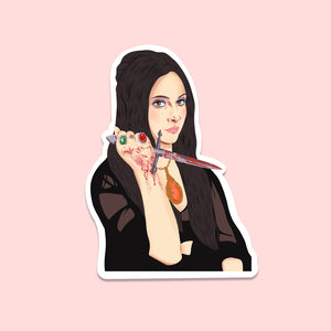 image of a die cut sticker featuring an illustration of elaine from the love witch holding a bloody knife